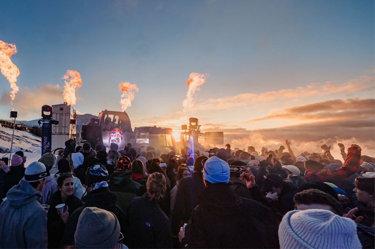 M87 open-air event at Mt Buller with crowd and sunset